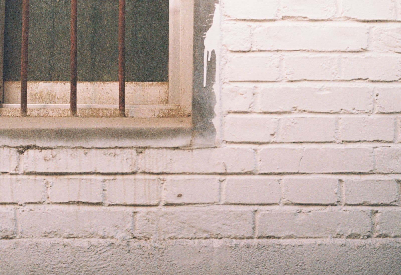 White painted brick wall around a window