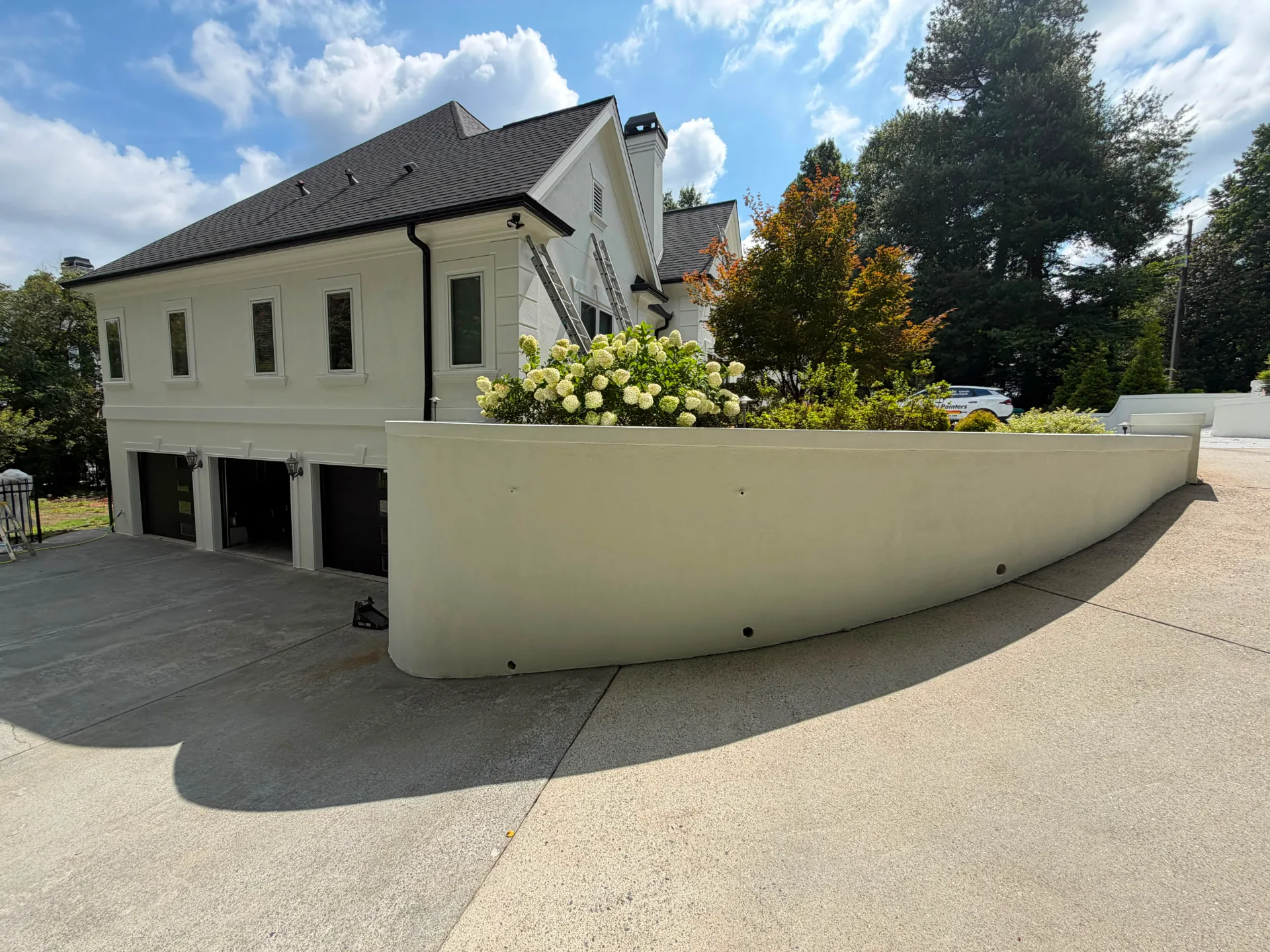 Exterior of a freshly painted Sandy Springs home with soft gray siding and white trim